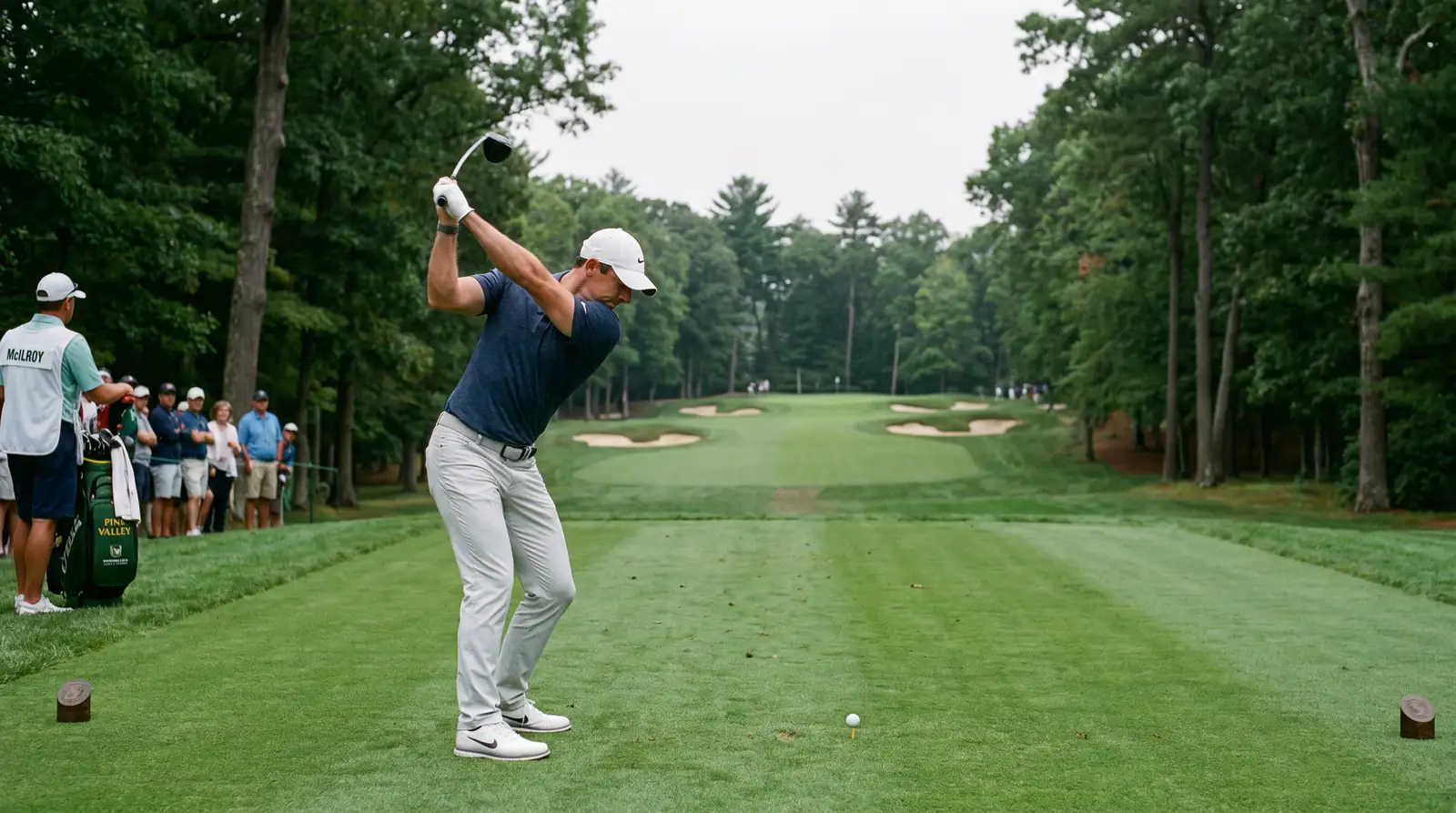 Professional golfer executing a controlled tee shot focused on driving accuracy rather than distance