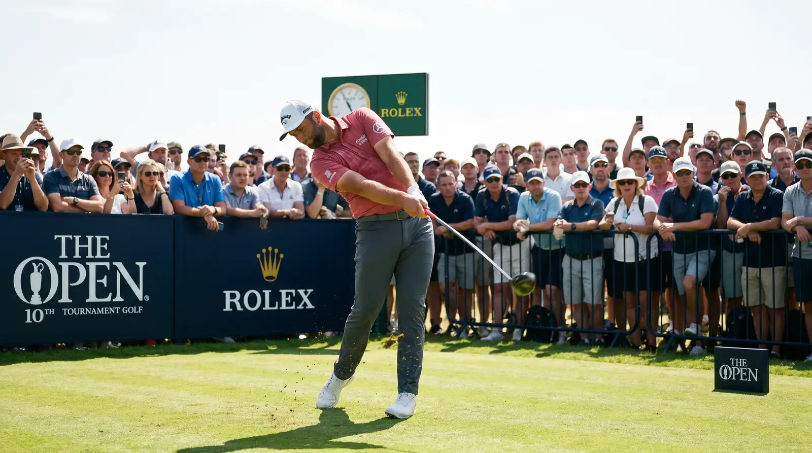 Professional golfer teeing off at a tournament with spectators watching along the fairway