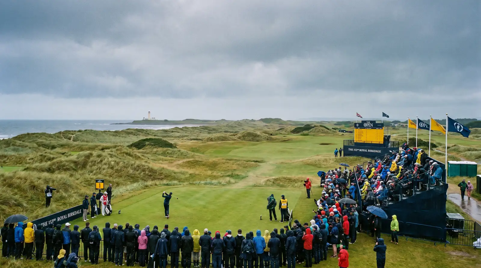 Exposed links golf course with no trees showing wind-swept rough and a distant lighthouse